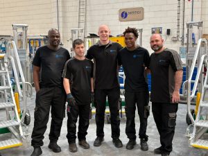 Double-shift late shift team Semmco's late shift team standing together in the Semmco manufacturing facility